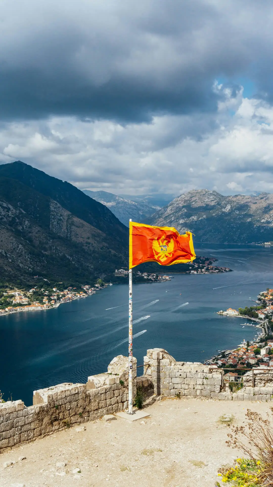 Mountainous landscape of northern Montenegro with the national flag flying
