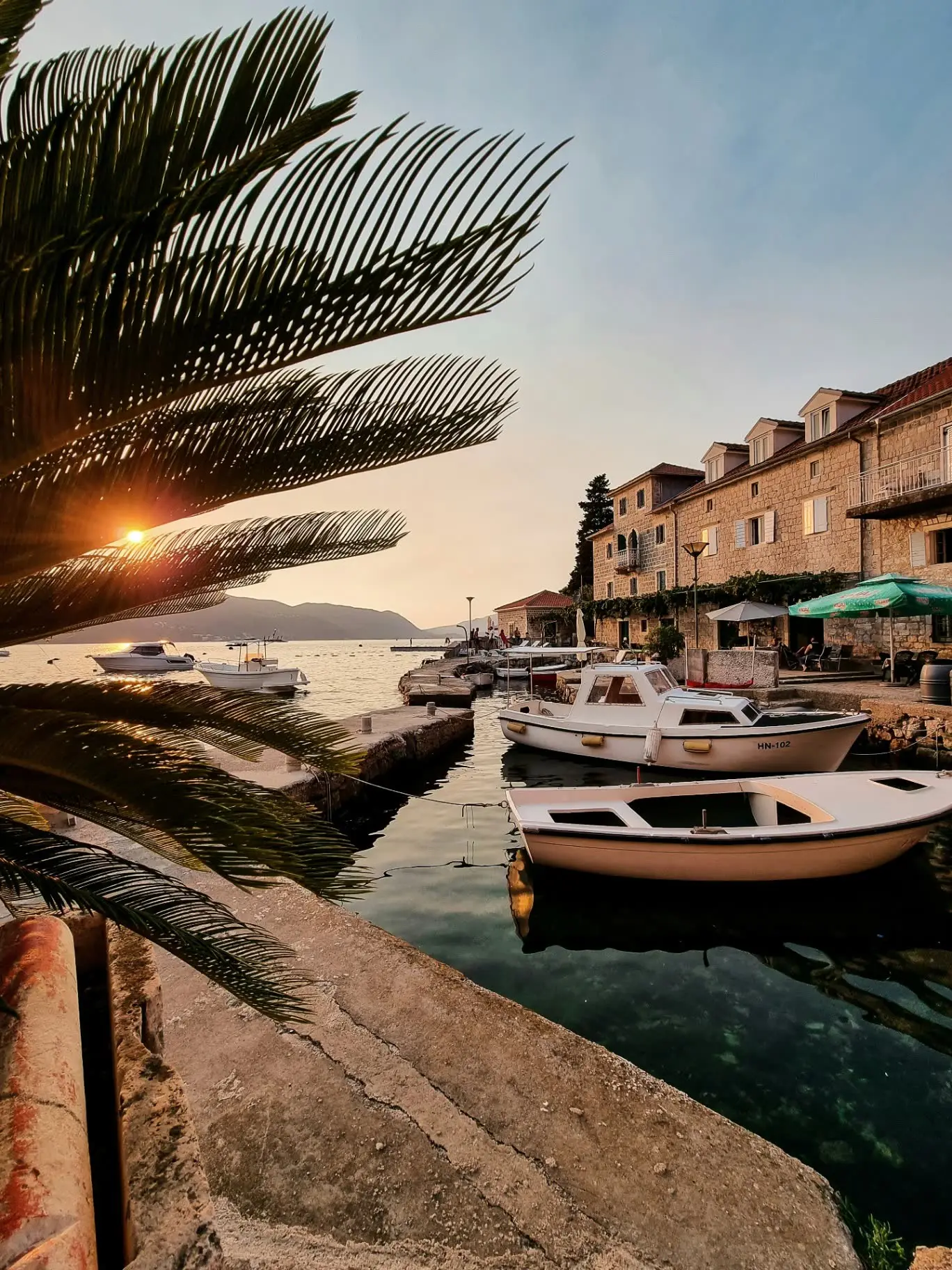 Sunset over a harbour on the Montenegrin Adriatic coast