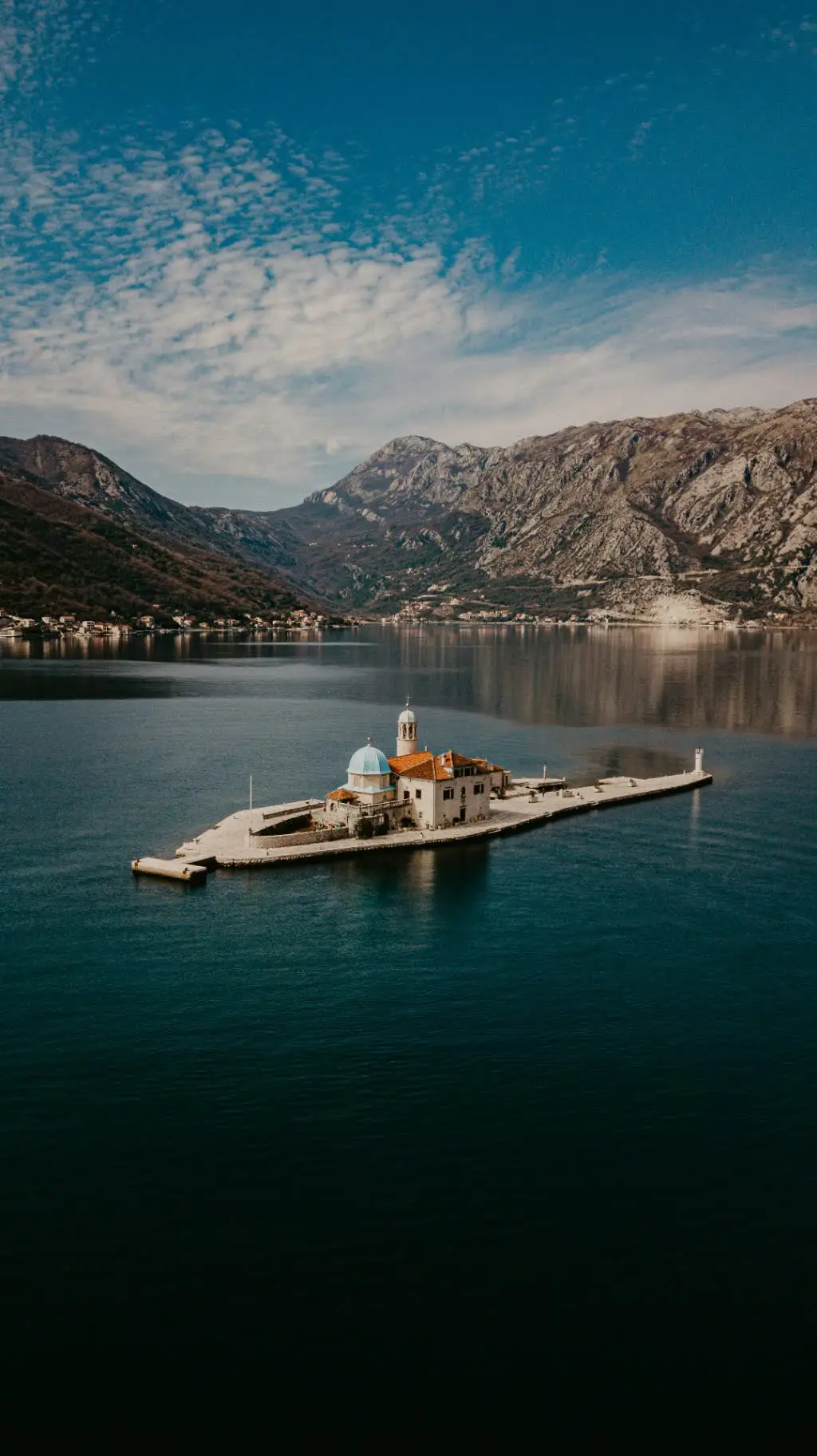 Traditional Montenegrin coastal dining setting near the water